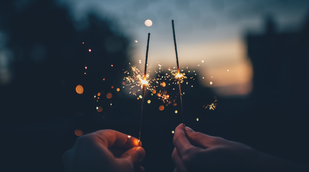 Person holding sparklers 