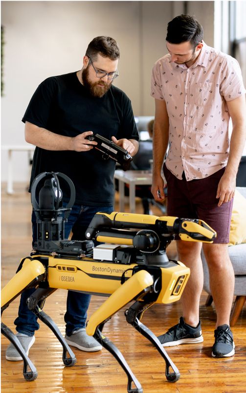 Members of our software development company working with Boston Dynamics' Spot robot